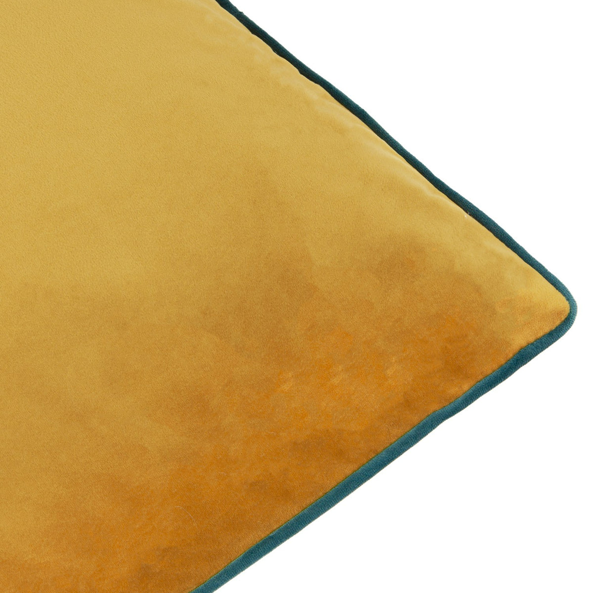 Close-up of the Meridian Plain Velvet Cushion in ochre, showing soft-touch velvet texture and teal piped edge trim against a white background.