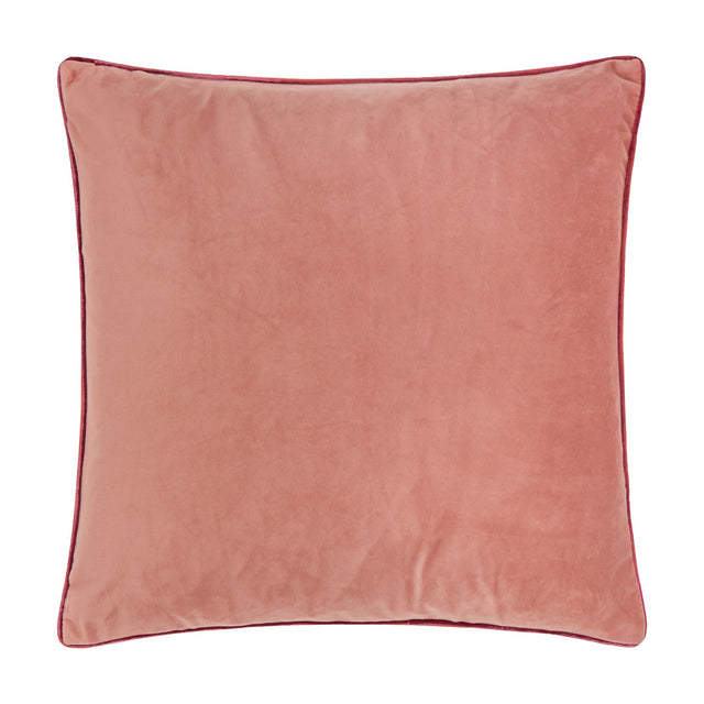 Meridian Plain Velvet Cushion in soft coral Slipper pink with contrasting burgundy piped edge trim, square shape, shown on a plain white background.