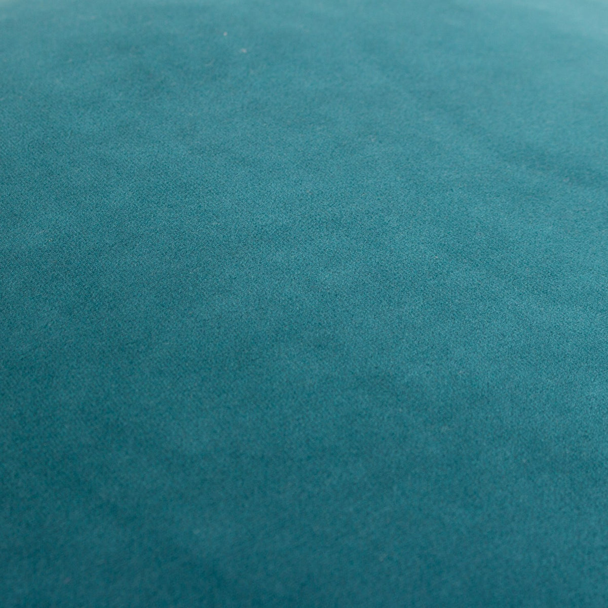 Close-up of the Meridian Plain Velvet Cushion in teal, showing the dense velvet nap and even fabric texture.