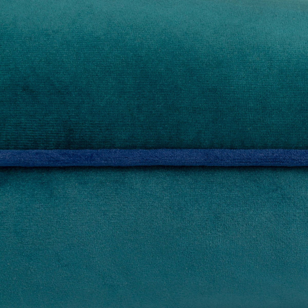 Close-up of the Meridian Plain Velvet Cushion in teal, showing the soft velvet-feel fabric with a contrasting navy piped trim edge detail.