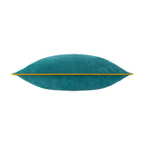 Meridian Plain Velvet Cushion in deep teal velvet, shown side-on with ochre-gold piped trim along the seam, on a plain white background.