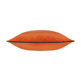 Meridian Plain Velvet Cushion in burnt orange velvet-feel fabric with contrast teal piping along the edge, shown side-on on a plain white background.