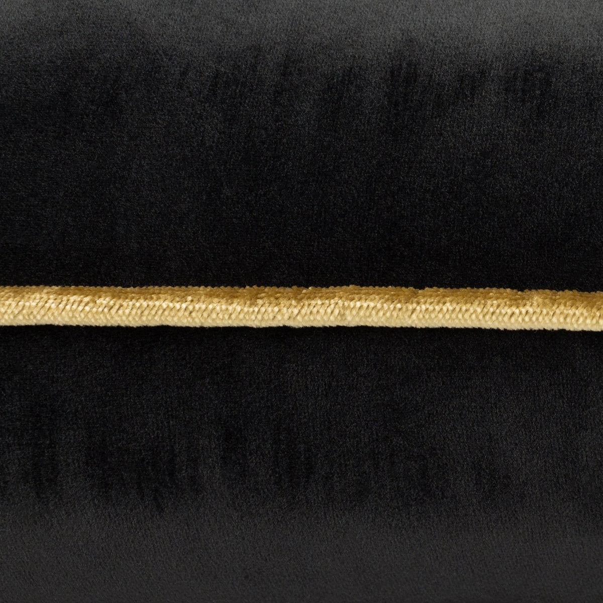 Close-up of the Meridian Plain Velvet Cushion in black, showing the soft velvet-feel fabric with a gold piped edge trim.
