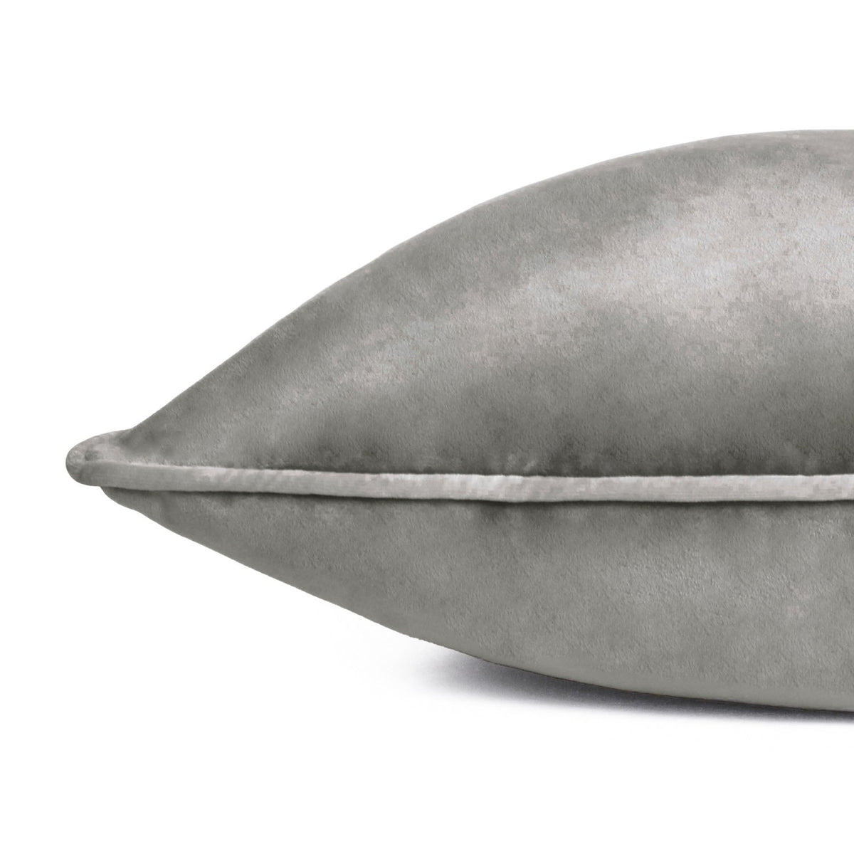Meridian Plain Velvet Cushion in charcoal grey, close-up of the corner showing velvet-feel fabric and contrasting dove silver piped edge, on a plain white background.