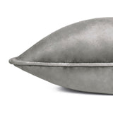 Meridian Plain Velvet Cushion in charcoal grey, close-up of the corner showing velvet-feel fabric and contrasting dove silver piped edge, on a plain white background.