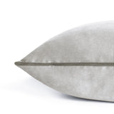 Meridian Plain Velvet Cushion in dove silver with contrasting charcoal piped edge, close-up corner detail on a plain white background.