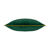 Meridian Plain Velvet Cushion in emerald green, shown side-on with moss green piped edge trim along the seam, plain background.
