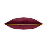 Meridian Plain Velvet Cushion in maroon velvet with moss green piped edging, shown lying flat on a plain white background.