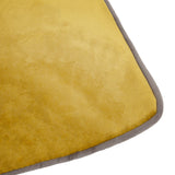 Close-up of the Meridian Plain Velvet Cushion in moss green, showing the soft velvet-feel pile fabric and contrasting charcoal grey piped edge.