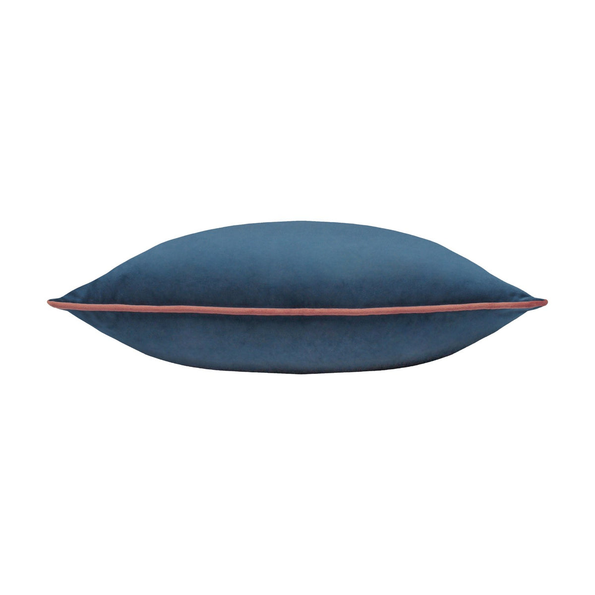 Meridian plain velvet cushion in petrol blue with contrasting blush pink piped edge, shown lying flat on a plain white background.