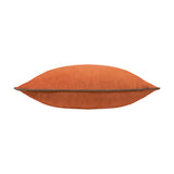 Meridian Plain Velvet Cushion in pumpkin orange with mocha brown piped edging, shown side-on against a plain white background.