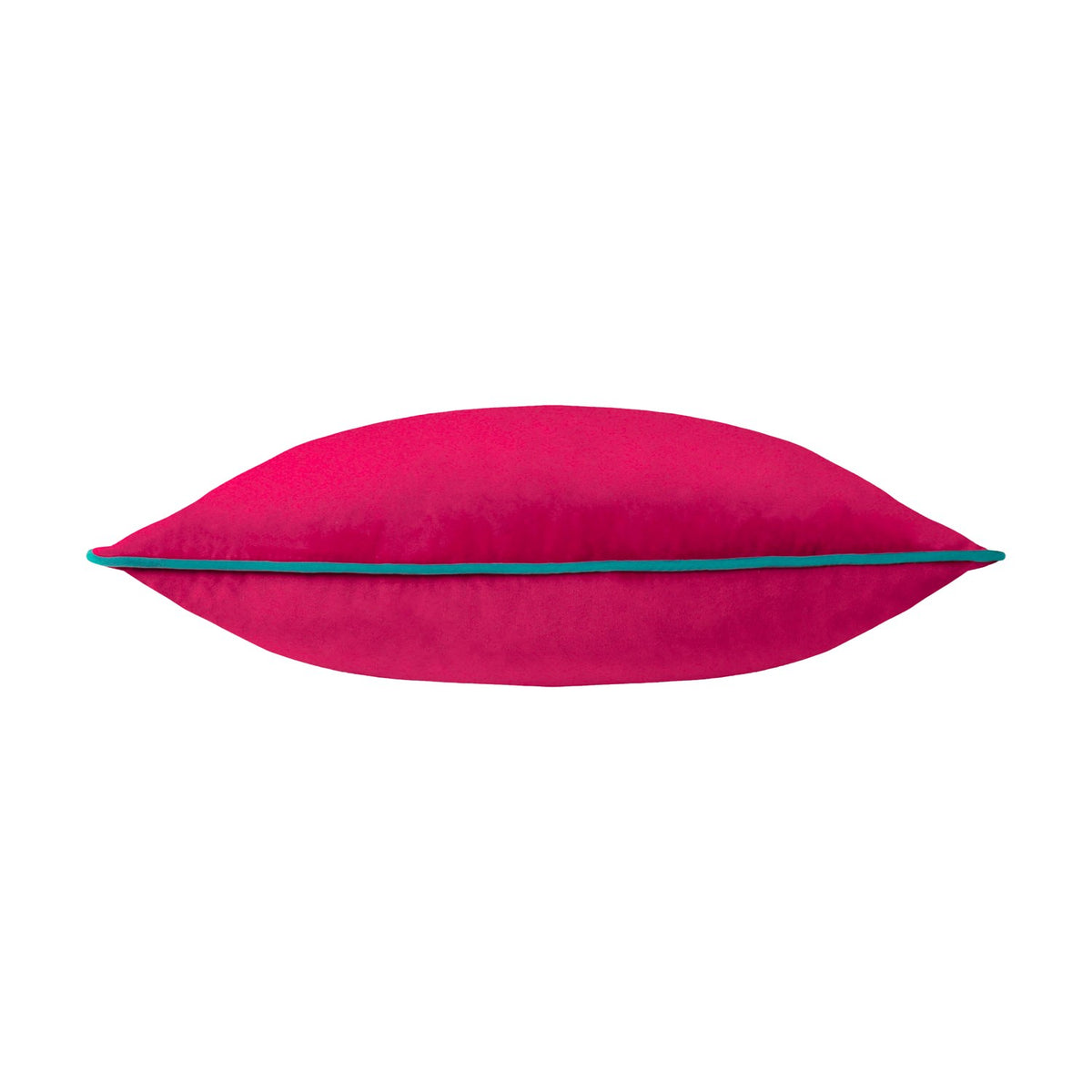 Meridian Plain Velvet Cushion in raspberry pink with contrasting teal piped edge trim, shown side-on to highlight its plump velvet shape, on a plain white background.