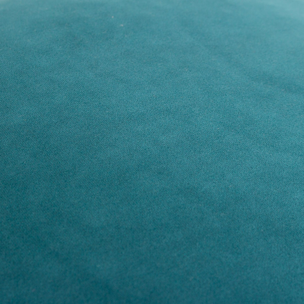 Close-up of the Meridian Plain Velvet Cushion in deep teal, showing the soft velvet-feel polyester fabric with a subtle sheen across the surface.