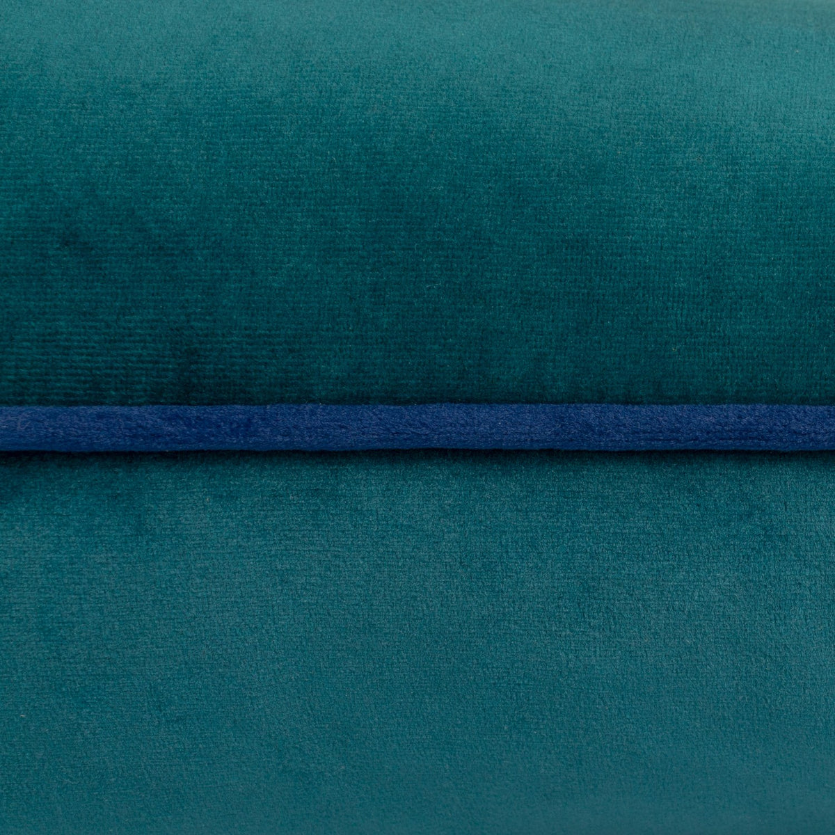 Close-up of the Meridian Plain Velvet Cushion in teal, showing the soft velvet fabric texture and contrasting navy blue piped edge trim.