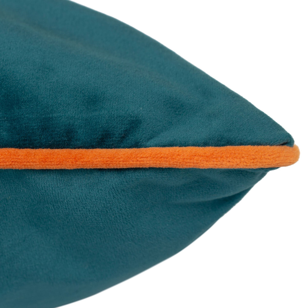 Close-up of the Meridian Plain Velvet Cushion in teal, showing the velvet fabric texture and contrasting tiger orange piped edge on a white background.