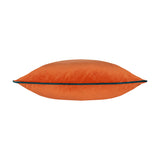 Meridian Plain Velvet Cushion in tiger orange with contrasting teal piped edge, shown side-on against a plain white background.