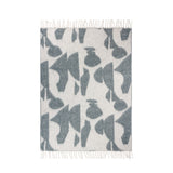 Meta Jacquard Polyester Throw in Dusk, cream ground with abstract blue-grey geometric shapes, faux mohair finish and knotted fringe edges, shown flat on a white background.