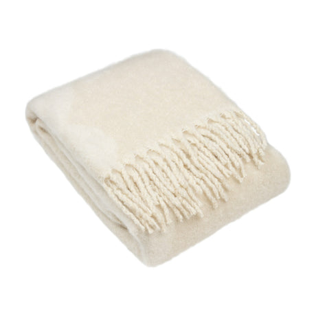 Meta Jacquard Polyester Throw in natural, folded to show soft brushed fabric with a subtle abstract pattern and twisted tassel fringe, on a plain white background.