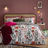 Mila Bows Reversible Animal Duvet Cover Set in Leopard, shown on a bed with bow-print pillowcases and matching leopard-print reverse, styled in a pink bedroom.