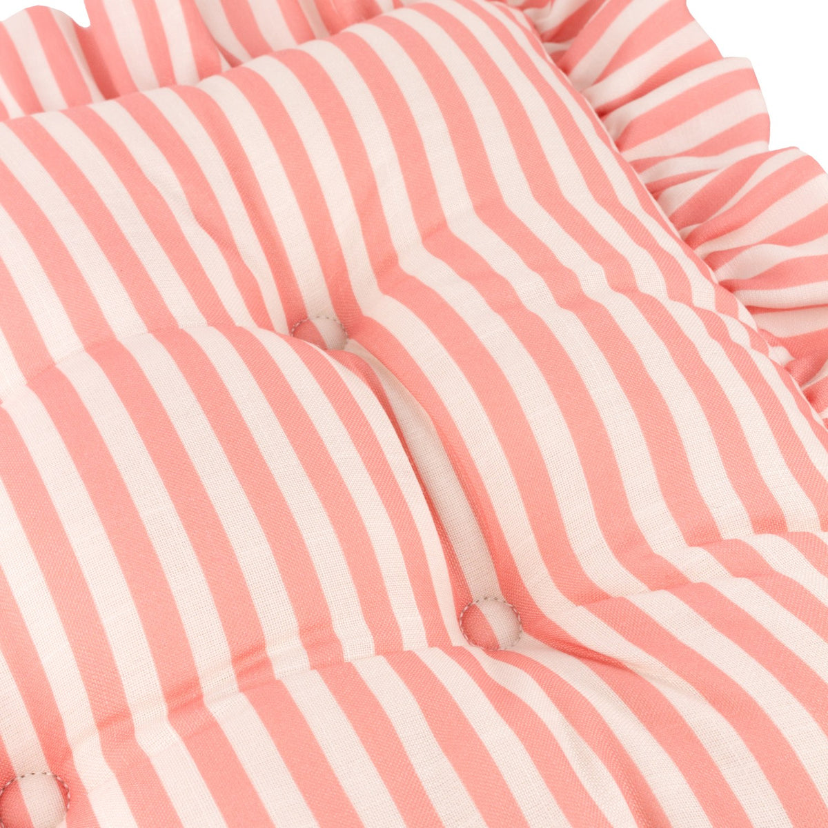 Close-up of the Millie Ruffle Striped Polyester Seat Pad in pink and white, showing buttoned tufts and woven stripe fabric with a gathered ruffle edge.