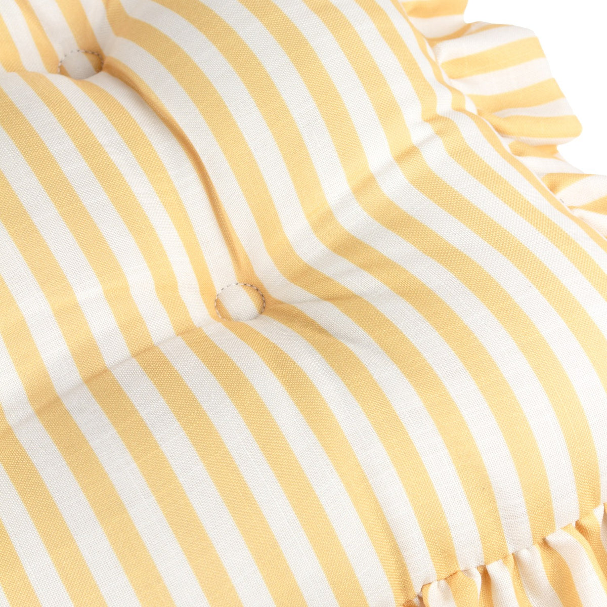 Close-up of the Millie Ruffle Striped Polyester Seat Pad in yellow and white, showing tufted button detail and a ruffled edge trim.