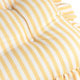 Close-up of the Millie Ruffle Striped Polyester Seat Pad in yellow and white, showing tufted button detail and a ruffled edge trim.