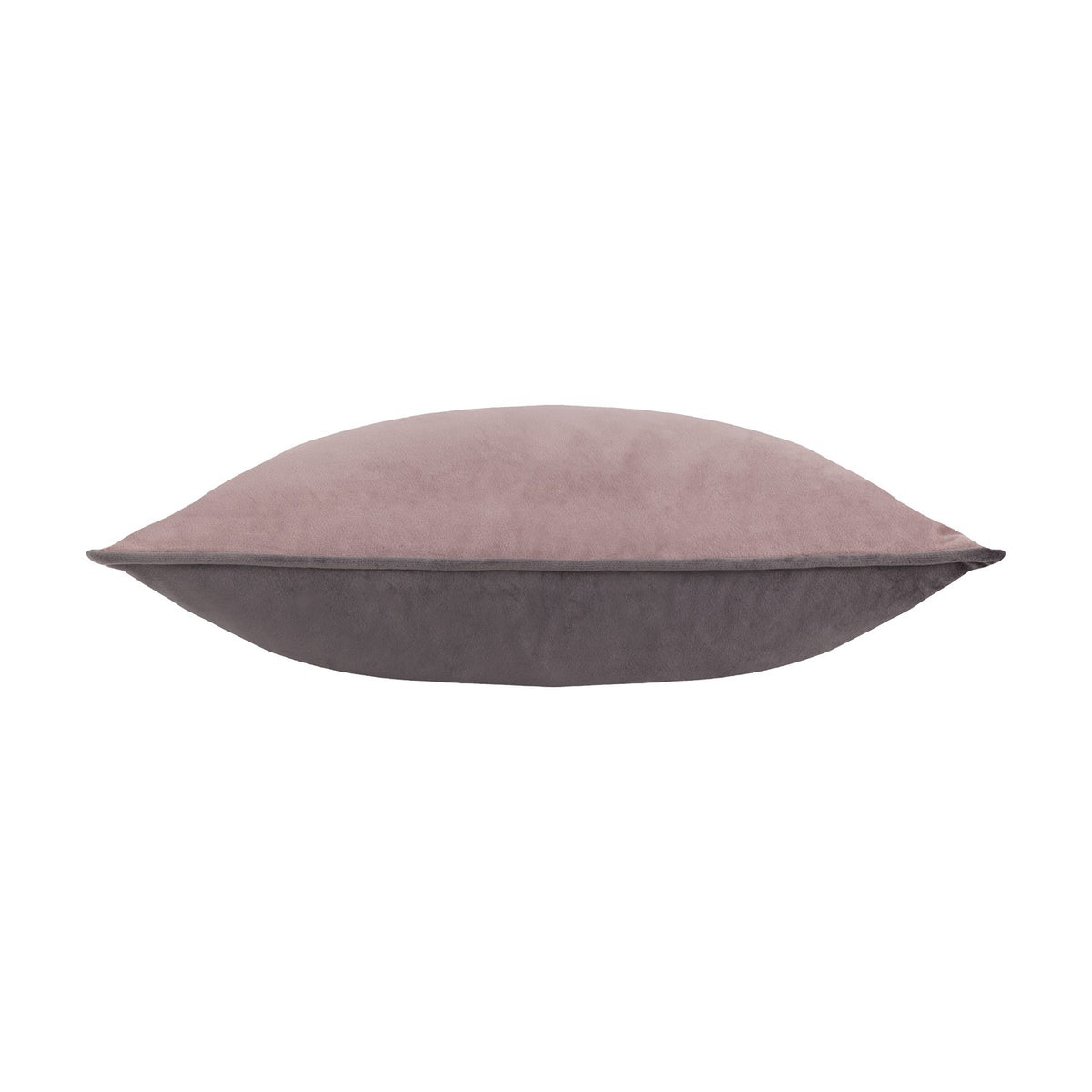 Side view of the Moonlit Flight velvet cushion showing dusty pink and grey tones, plump square shape with piped edges, on a plain white background.