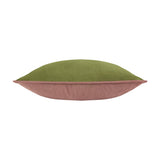 Side view of the Moonlit Flight velvet cushion showing olive green front and dusky pink reverse with piped edging, on a white background.