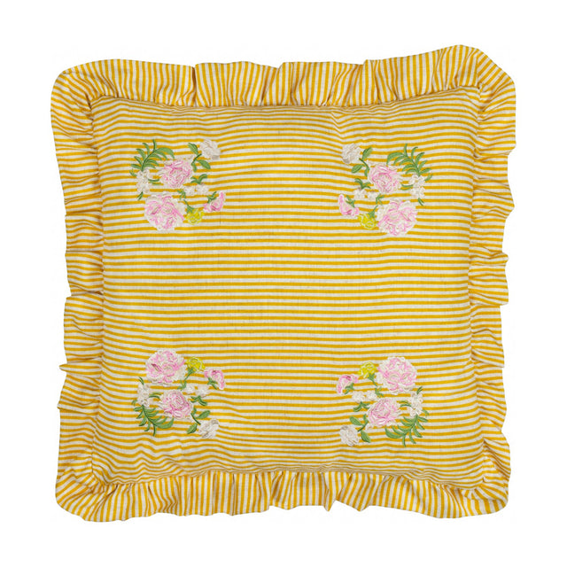 Martha Floral Linen Cushion in yellow-and-cream stripe with pink floral embroidery in each corner and a ruffled edge trim, shown on a plain white background.