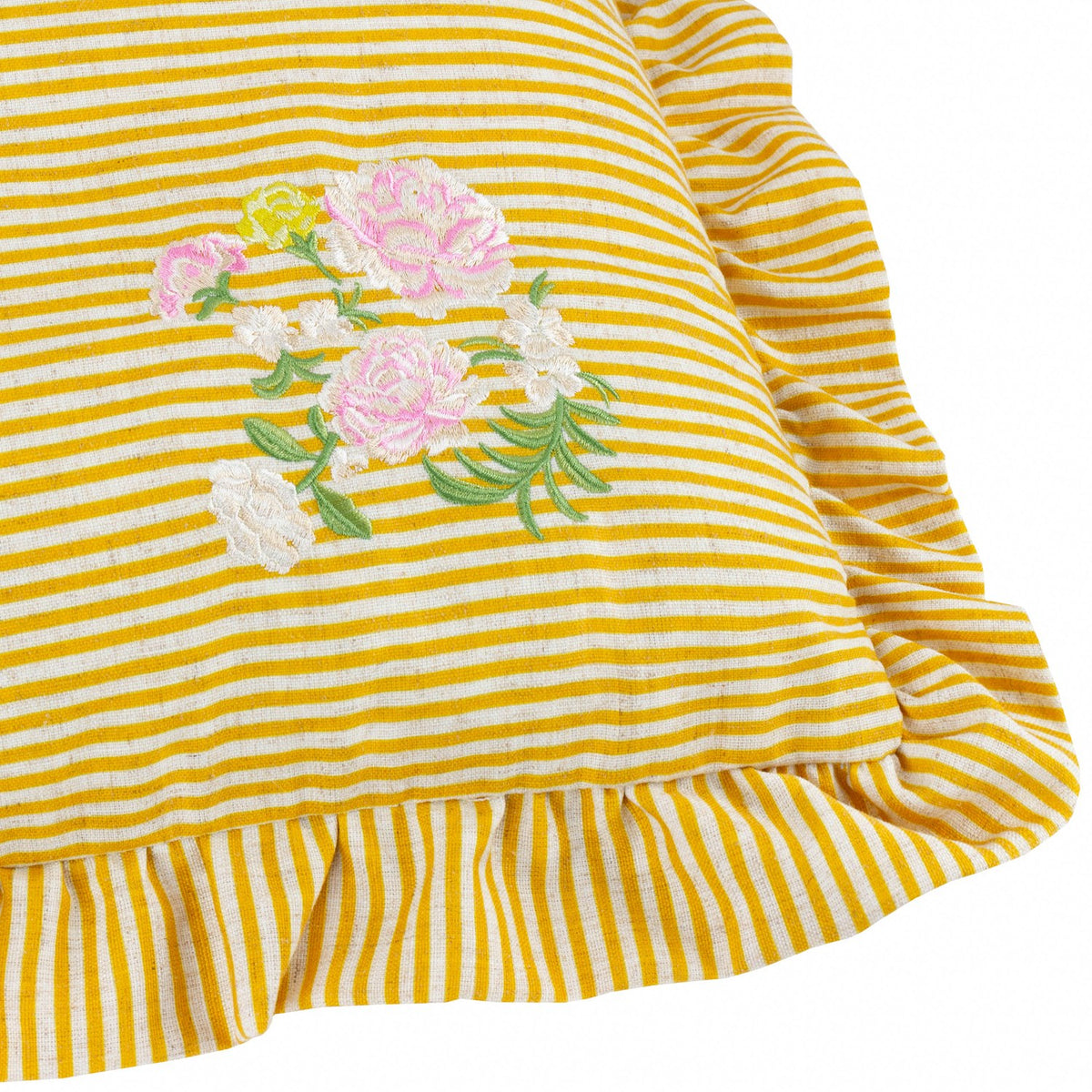 Martha Floral Linen Cushion in yellow-and-cream stripe with pink and cream floral embroidery and green foliage detail, ruffled edge trim, shown close-up on a white background.