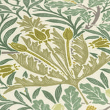 Close-up of the Multi Acorn Woodland polyester cushion fabric, showing sage and stone green leaf, branch and bud motifs printed on a cream ground.