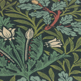 Close-up of the Multi Acorn Woodland polyester cushion in Thyme/Forest green, showing dense oak leaf, acorn, and floral bud print detail.