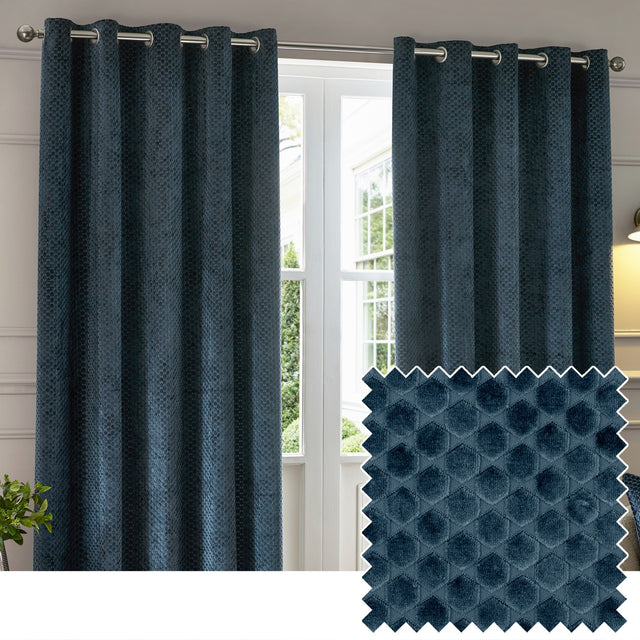 Neptune Velvet Fully Lined Eyelet Curtains in navy, hung on a metal pole in a living room, showing a raised geometric pile pattern with a matching fabric swatch inset.