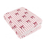 Noortje Bows Silk Throw folded on a white background, showing a fleece face with red bow and stripe print alongside a curly sherpa fleece reverse.