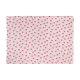 Noortje Bows Silk Throw in pink, folded flat on a white background, showing a fine red vertical stripe pattern with small bow motifs across the fabric.