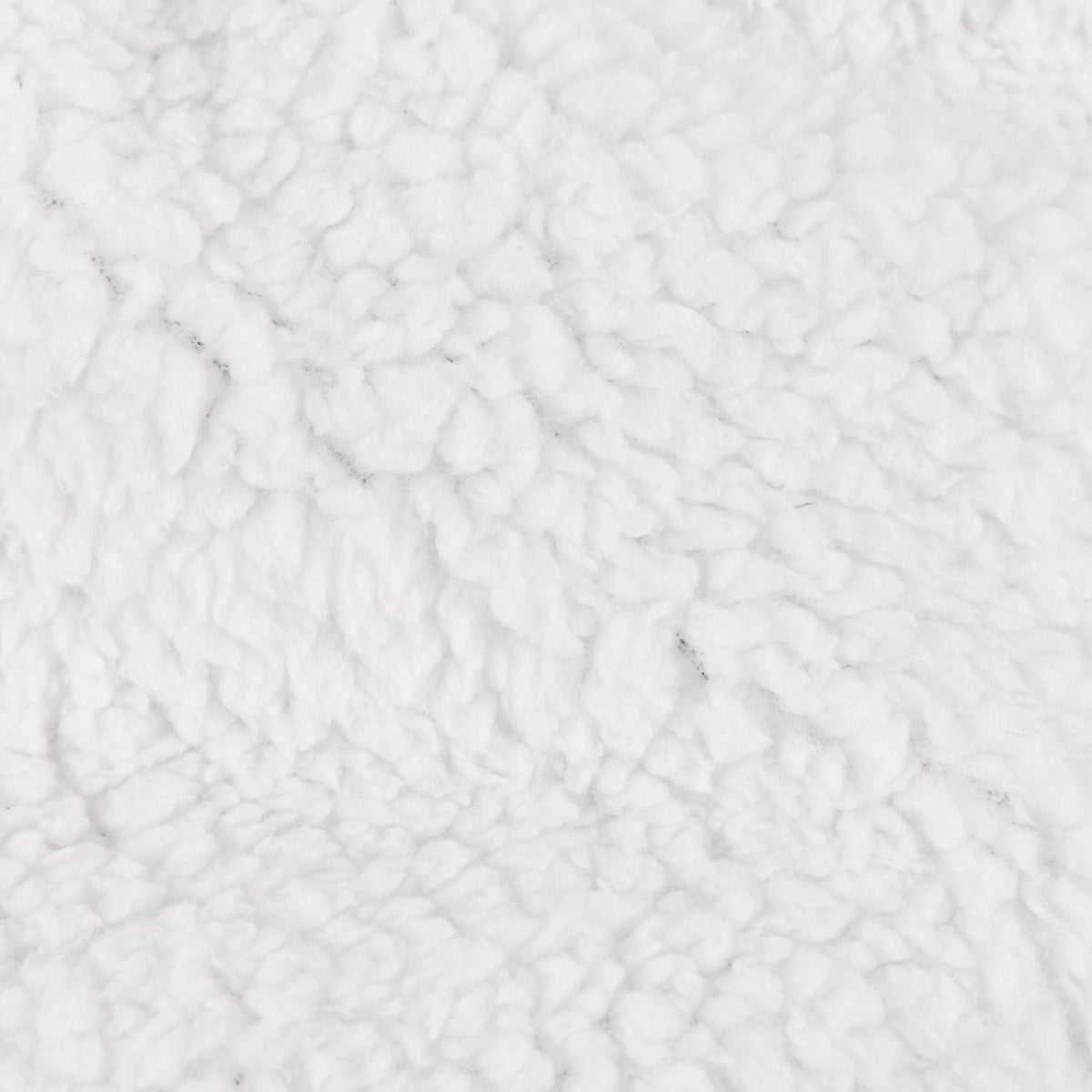 Close-up of the Noortje Bows Silk Throw's reverse side, showing a dense white sherpa fleece texture in polyester.