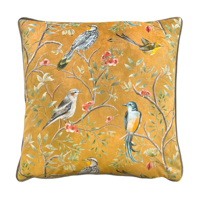 Orient Animal Velvet Cushion in gold, square with piped edges, featuring five hand-painted tropical birds among floral branches on a plain white background.
