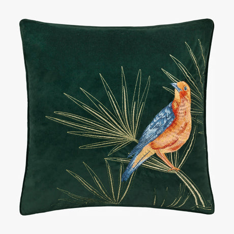 Odisha Exotic Bird Animal Velvet Cushion in emerald green, square with piped edge, showing an embroidered orange and blue bird among gold-thread palm fronds, on a plain white background.