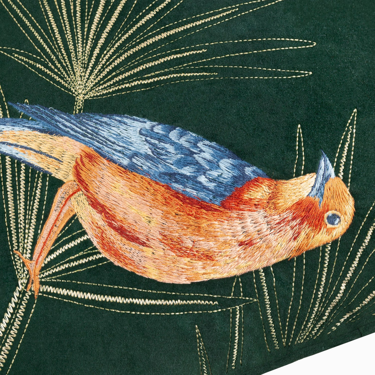 Odisha Exotic Bird Animal Velvet Cushion in Emerald, close-up of embroidered orange and blue bird with gold thread fern fronds on dark green velvet.
