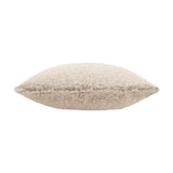 Side view of the Olann Faux Fur Cushion in natural beige, showing its curly shearling-style pile and plump square shape on a plain white background.