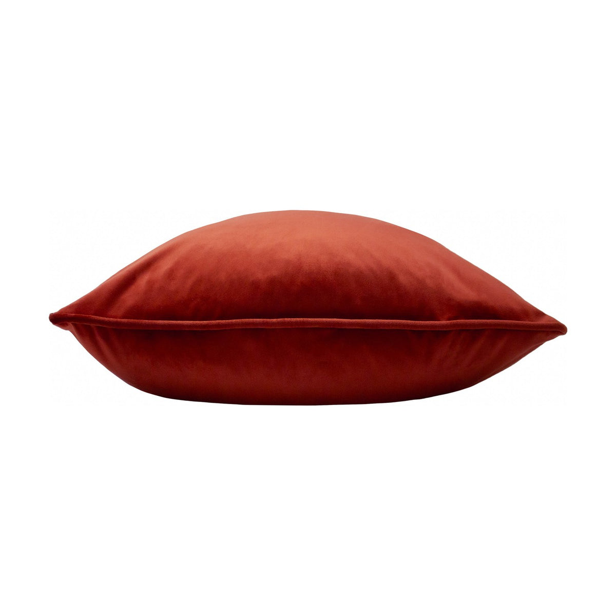 Opulence Plain Velvet Cushion in Sunset rust-orange, shown side-on with piped edge detail and plump velvet pile, against a plain white background.