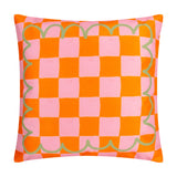 Square polyester cushion with an orange and pink checkerboard pattern, edged with a scalloped sage green outline, shown on a plain white background.