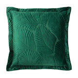 Palmeria Velvet Cotton Cushion in emerald green, a square cushion with a raised quilted palm-leaf design and flanged edge, shown on a plain white background.