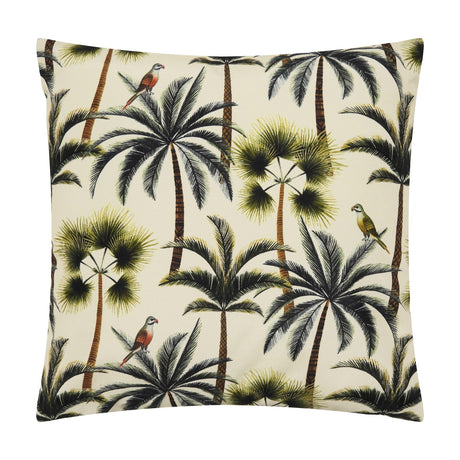 Square outdoor scatter cushion in cream with a repeated palm tree print in green and olive tones, featuring perched parrots, on a plain white background.