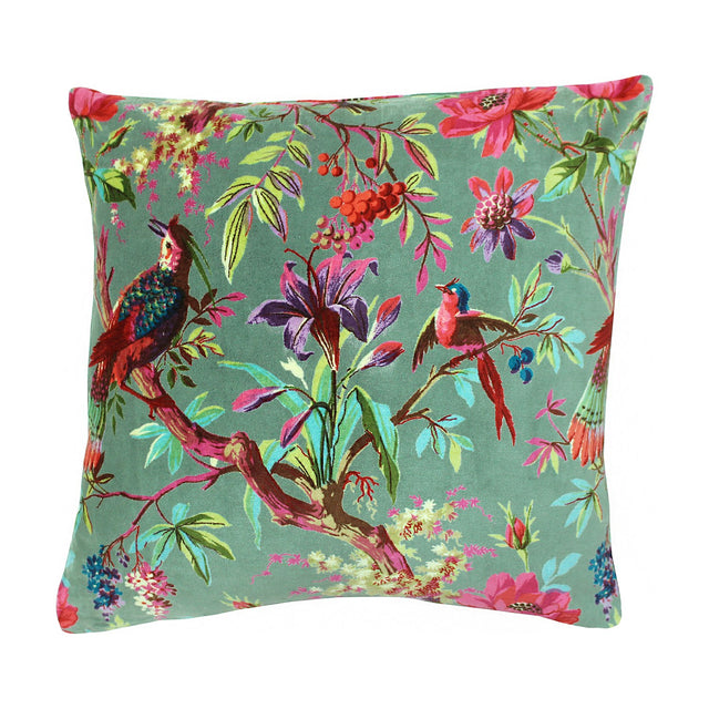 Paradise Velvet Cotton Cushion in Mineral, a square green cotton velvet cushion printed with perched birds, lilies and branches in red, teal and coral, shown on a white background.