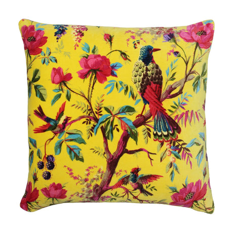 Paradise Velvet Cotton Cushion in yellow, 50x50cm square with a chinoiserie print of perched birds, roses and trailing foliage on velvet-feel cotton, shown on a white background.
