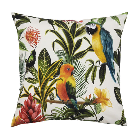 Square polyester cushion with a tropical print on a white background, featuring a blue and gold macaw, an orange and green parrot, a small green bird, palm leaves and red and yellow flowers.