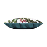 Side view of the Parrots Animal Polyester Cushion, showing white tropical-print fabric with green foliage and pink flowers on top and a solid teal palm-leaf reverse, on a plain background.