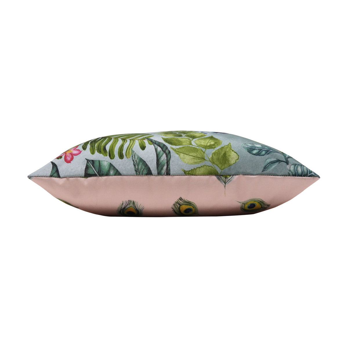 Side view of the Peacock Animal Polyester Cushion, showing green foliage print on one side and dusky pink fabric with peacock-feather motifs on the other, set against a white background.