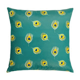 Square polyester outdoor cushion in teal, showing the reverse print of scattered peacock feather eyes in green, yellow and blue on a plain background.